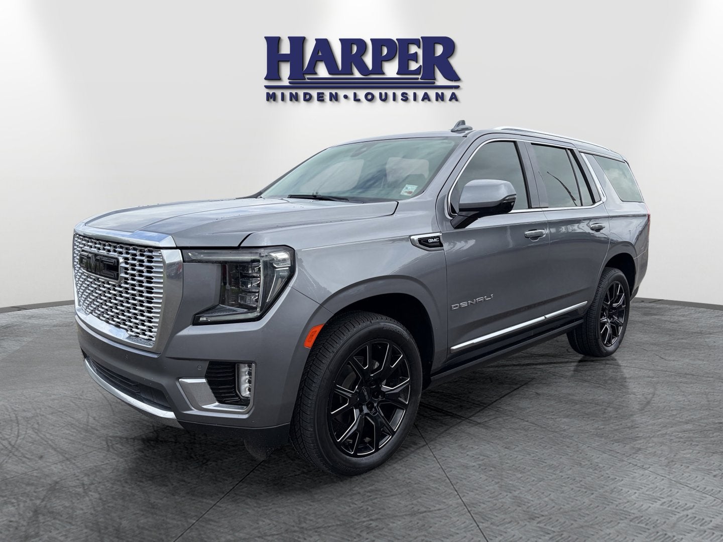 2021 GMC Yukon Denali in Satin Steel Metallic — front three-quarter view
