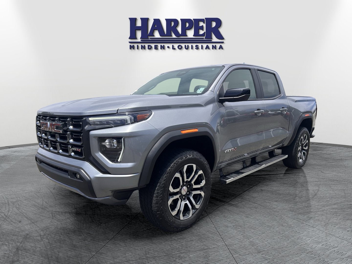 2024 GMC Canyon AT4 in Sterling Metallic — front three-quarter view